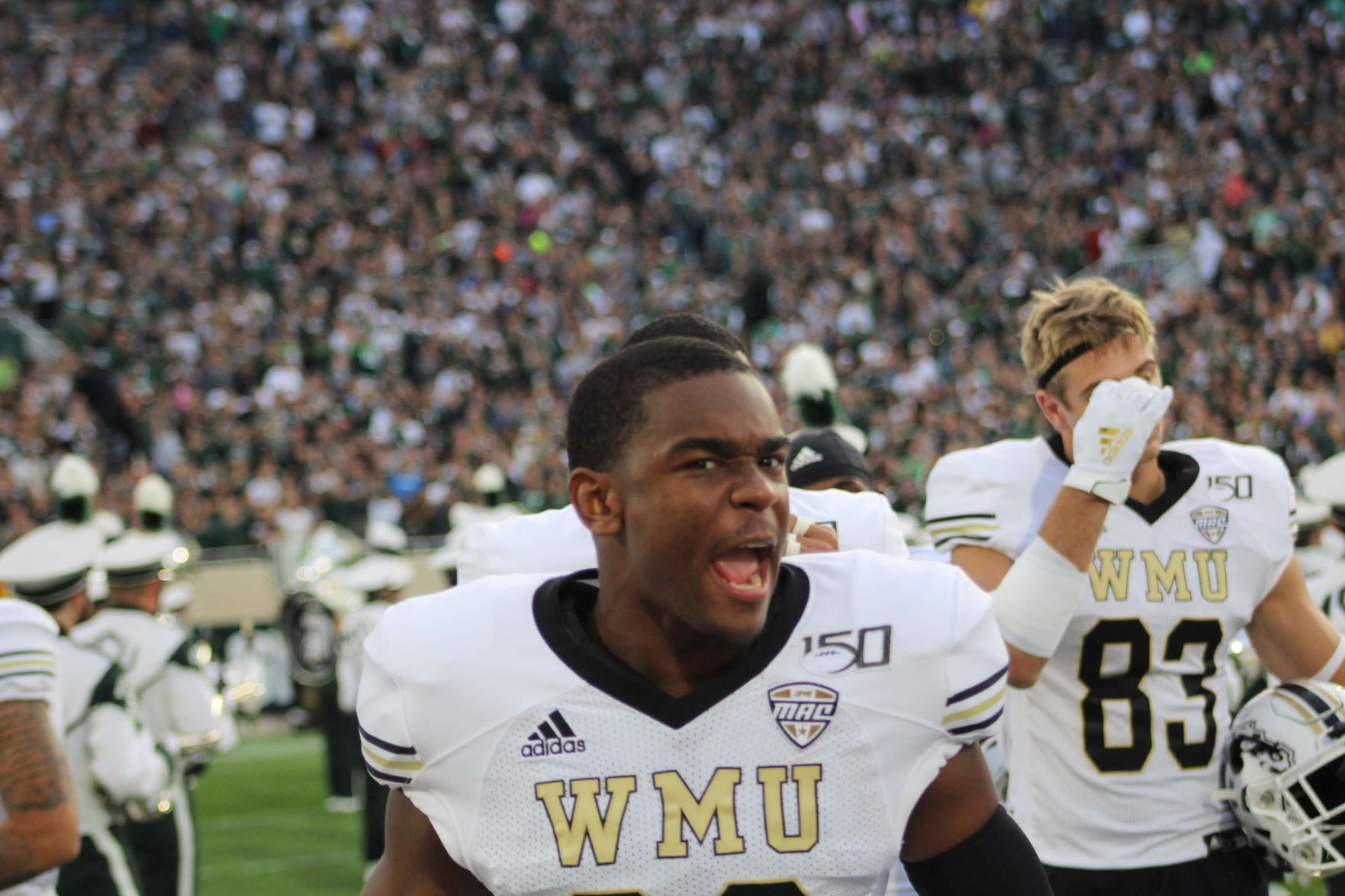 Sophomore cornerback K.J. Anderson pumps up his team before kickoff.